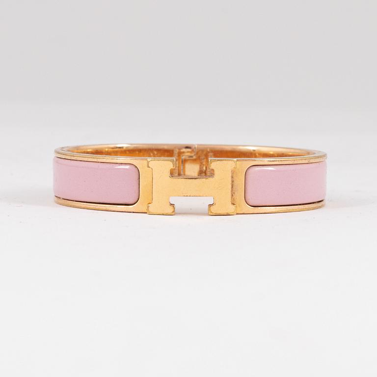 Hermès, a 'Clic H PM' bracelet.