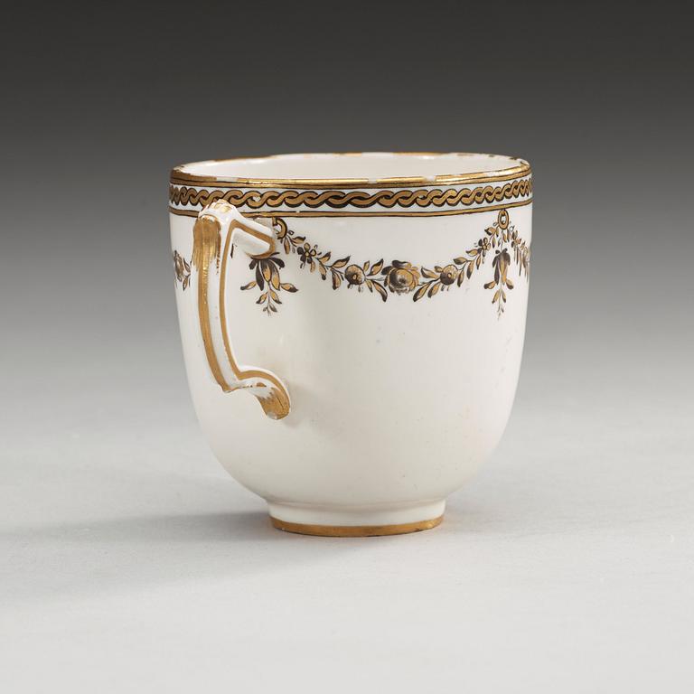 A Swedish Marieberg Armorial soft paste cup, dated 1781.