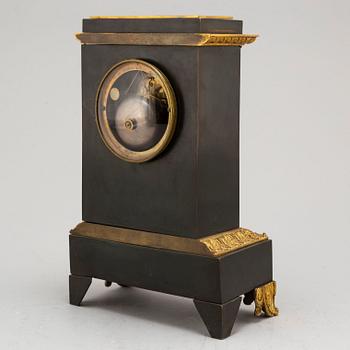 An Empire-style late 19th century mantel clock.