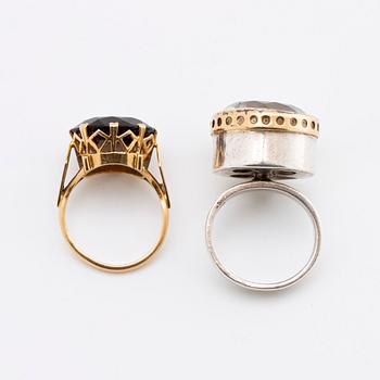 2 RINGS, 18K gold w smoky quartz approx 14 mm, silver and gold w rock crystal approx 16 mm, Stockholm 1963.