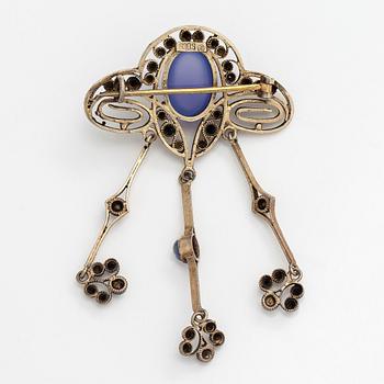 Brooch, cabochon-cut moonstones, gilded silver.