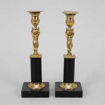 A pair of late gustavian candlesticks, circa 1800.