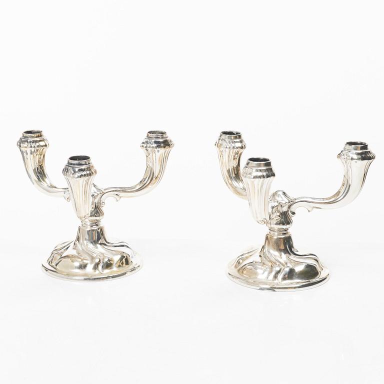 A pair of German silver candelabra, mark of Jakob Grimminger, Schwäbisch Gmünd, 20th century.