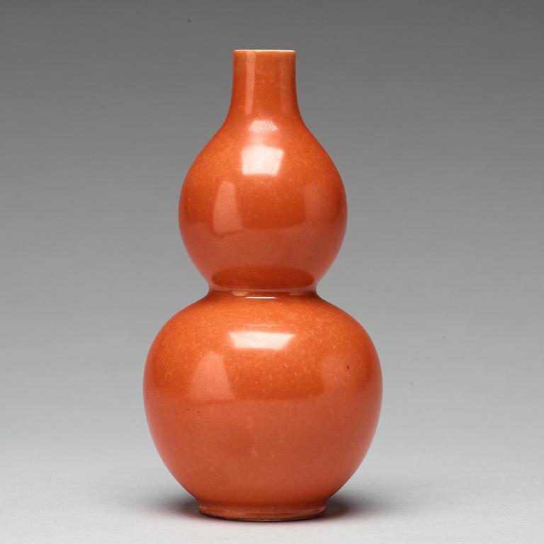 A coral red calebass shaped vase, Qing dynasty with Jiaqing mark (1796-1820).