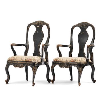 63. A pair of rococo armchairs in the manner of C. M. Sandberg, later part 18th century.