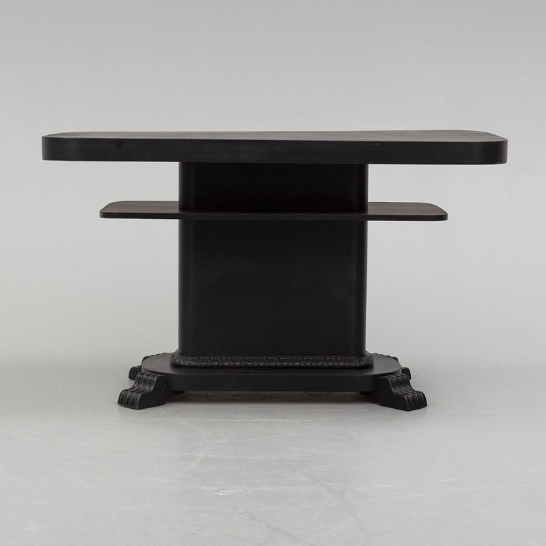 a coffee table from the first half of the 20th century.