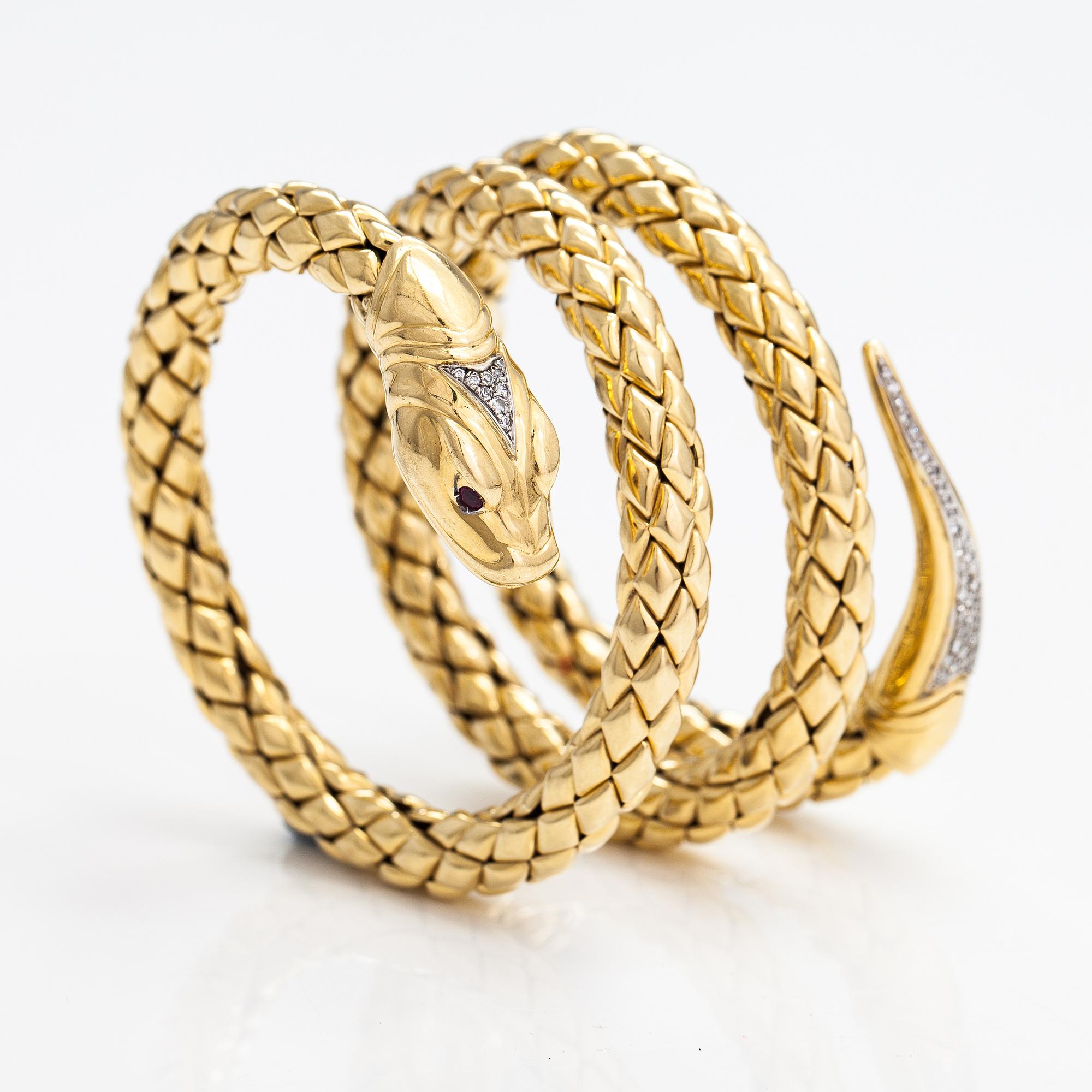 Chimento, An 18K gold snake bracelet with rubies and diamonds ca. 0.46 t in total. Italy.