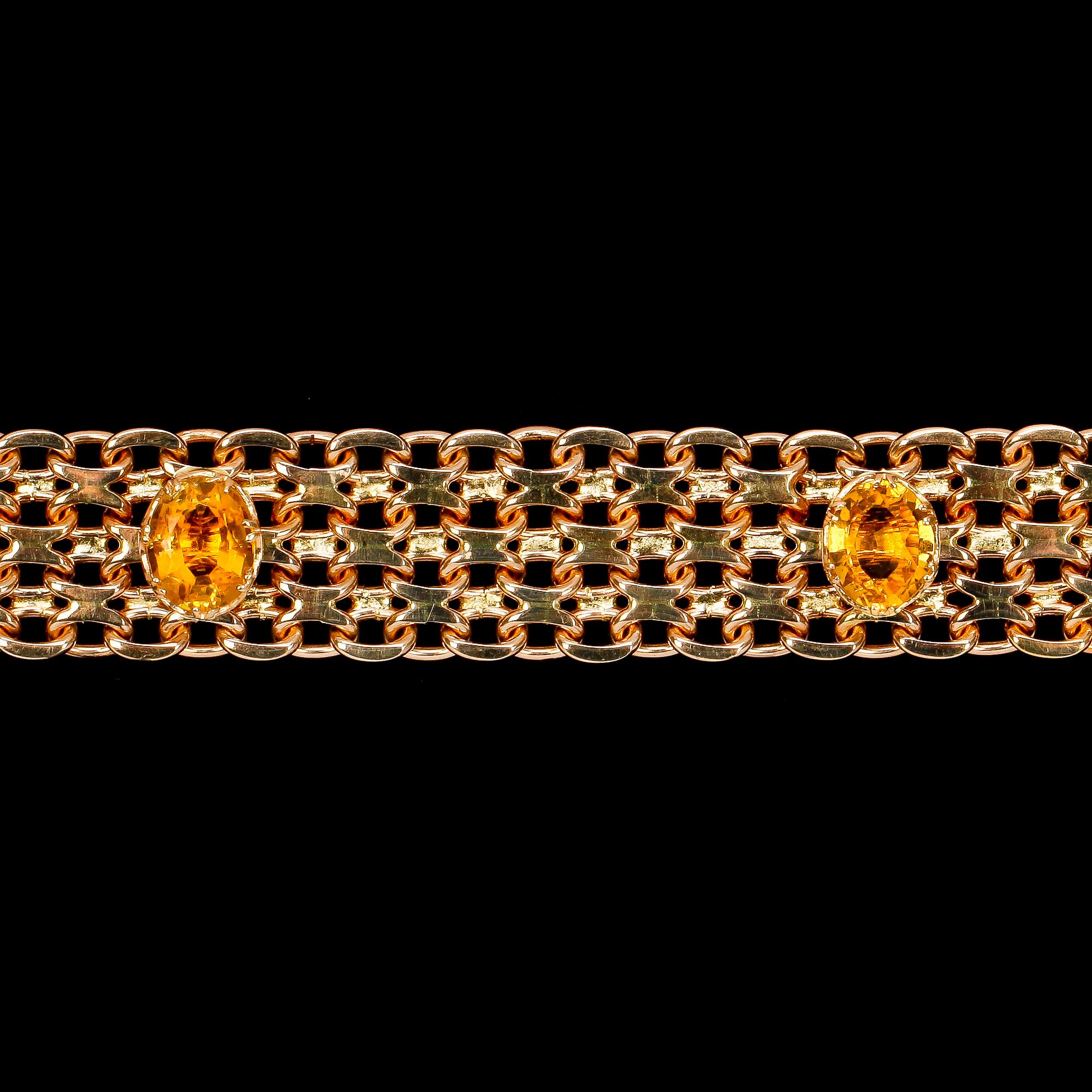 ARMBAND, x-länk med infattade citriner. Vikt 80 g.