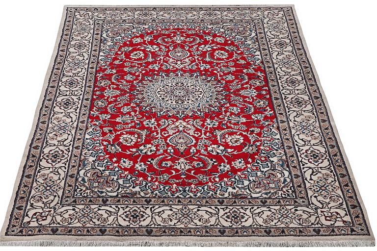 A Nain carpet, part silk, 9 laa, c. 303 x 198 cm.