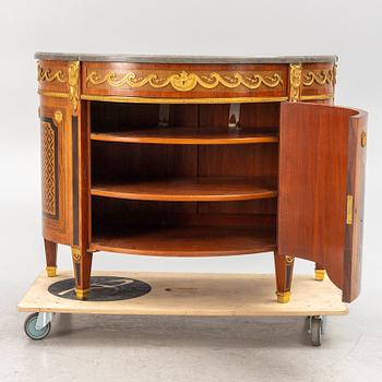 A Gustavian style cabinet with a stone top, 20th century.