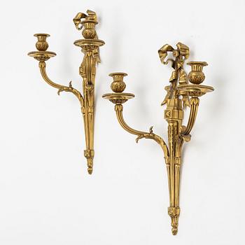 A pair of gilt-bronze Louis XVI-style two-branch appliques, circa 1900.