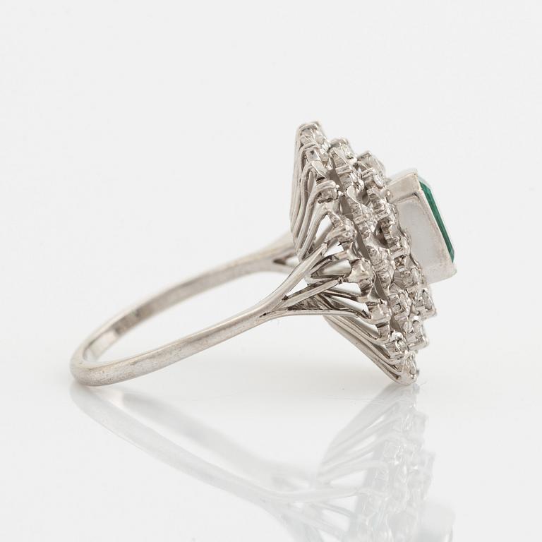 Emerald-cut emerald and eight cut diamond ring.