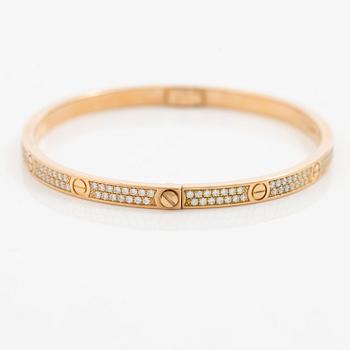 A Cartier bangle "Love" 18K rose gold with round brilliant-cut diamonds.