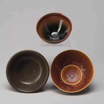 A group of three brown glazed bowls, China, 20th Century.