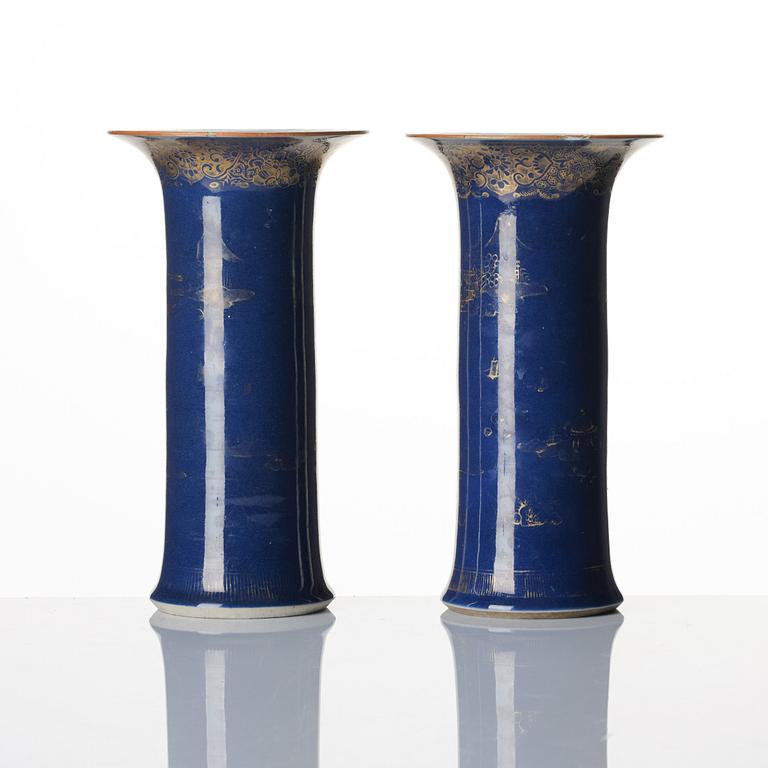 A pair of powder blue and gold 'trumpet' vases, Qing dynasty, 18th century.