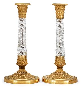 A pair of Russian circa 1830 gilt bronze and glas candlesticks.