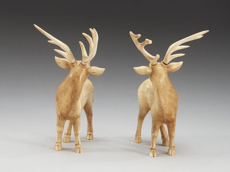 A pair of ivory figures of deers, Qing dynasty, presumably Qianlong (1736-95).