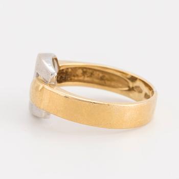 An 18K gold and white gold ring.