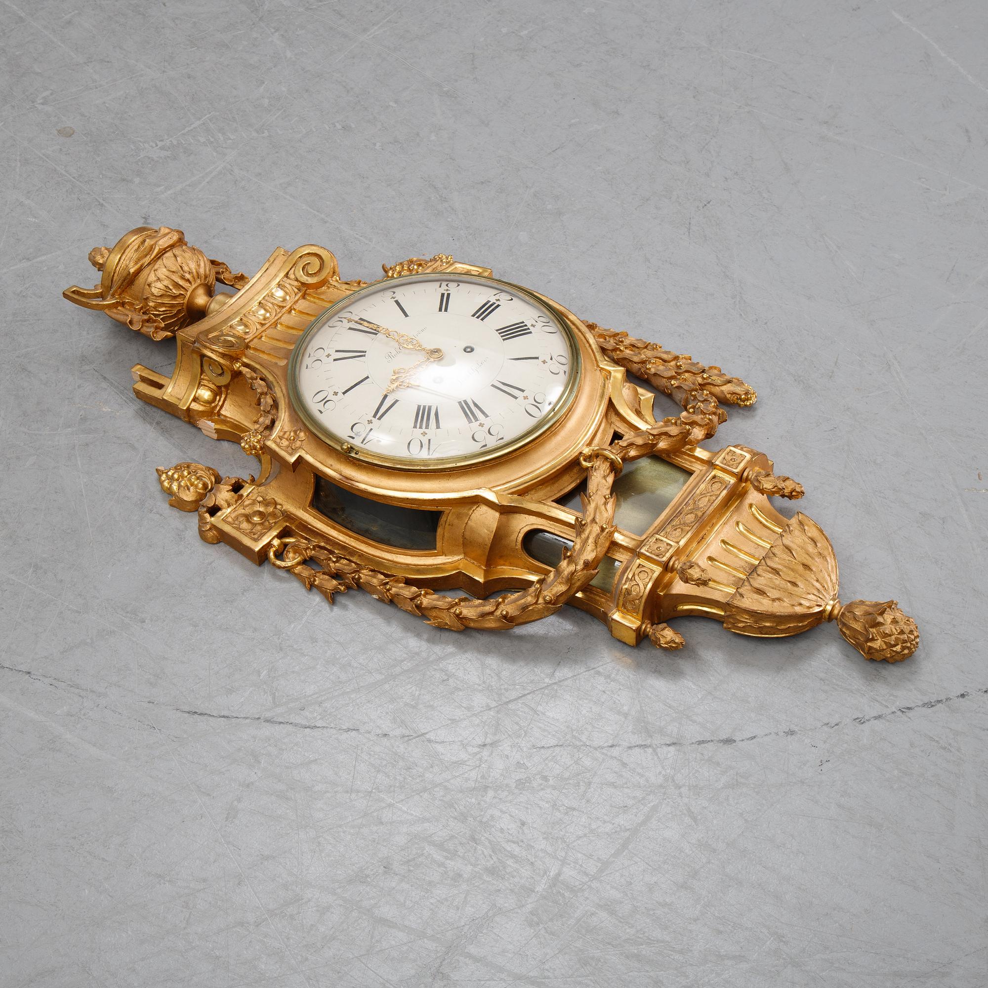 A gustavian style wall clock, signed Rob. Engström, Stockholm. First half of the 20th century.