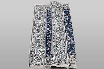 A carpet, Nain, part silk, ca 297 x 194 cm.
