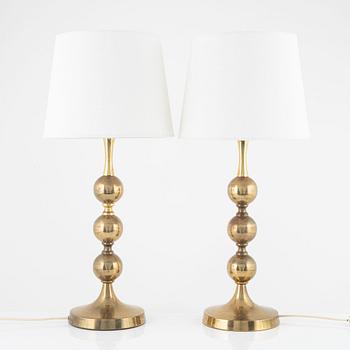 A pair of table lamps, yellow metal, second half of the 20th century.