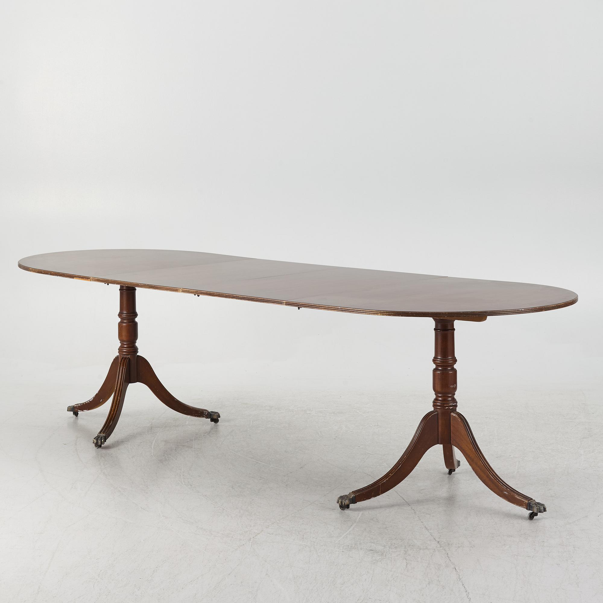 A dining table, 20th century, England.