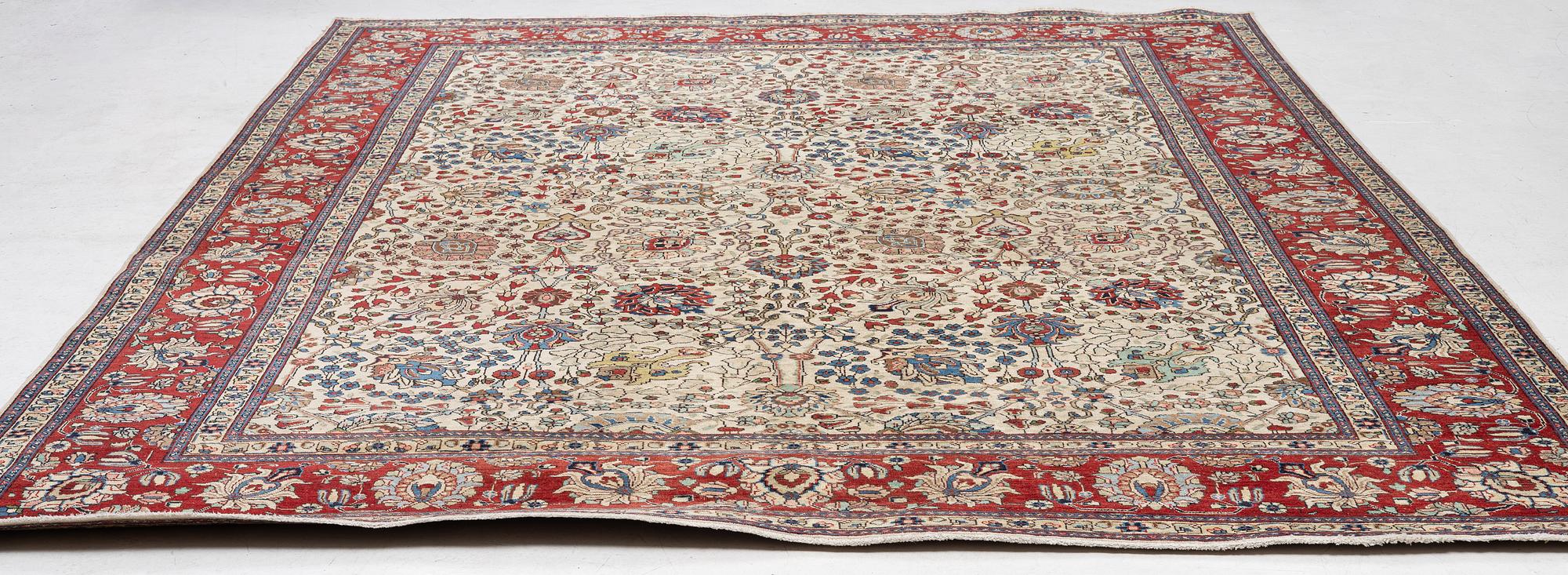 A Tabriz carpet, c. 385 x 287 cm.
