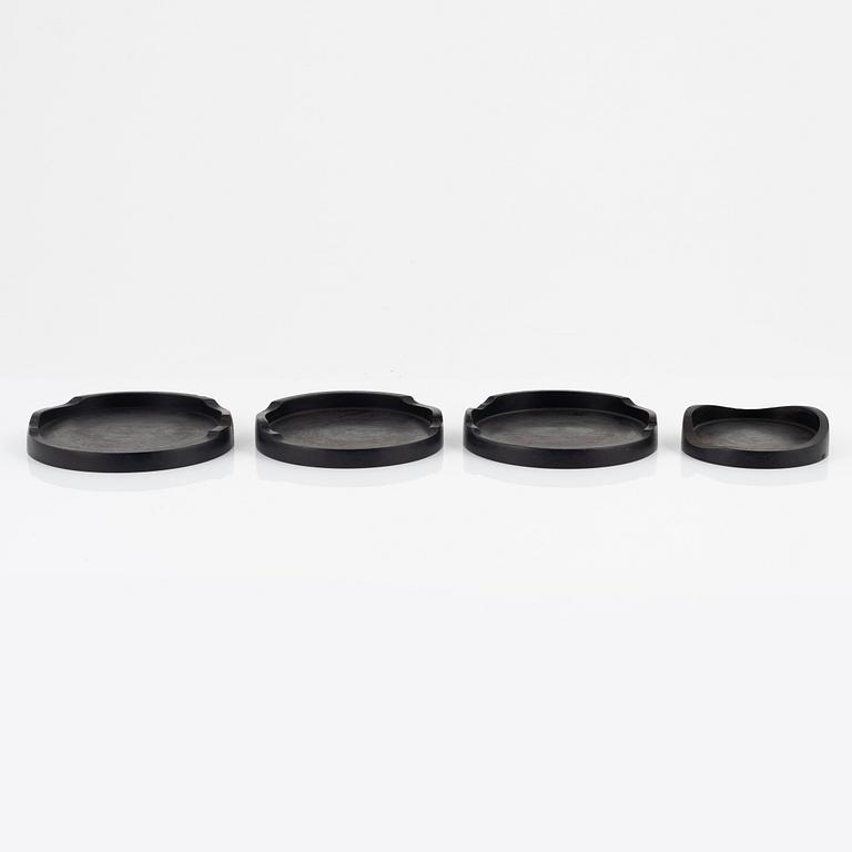 Magnus Ek, a set of four ebony coasters for Oaxen Krog.