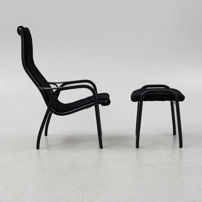 Yngve Ekström, a 'Lamino' armchair with stool, Swedese, Sweden, 2019.