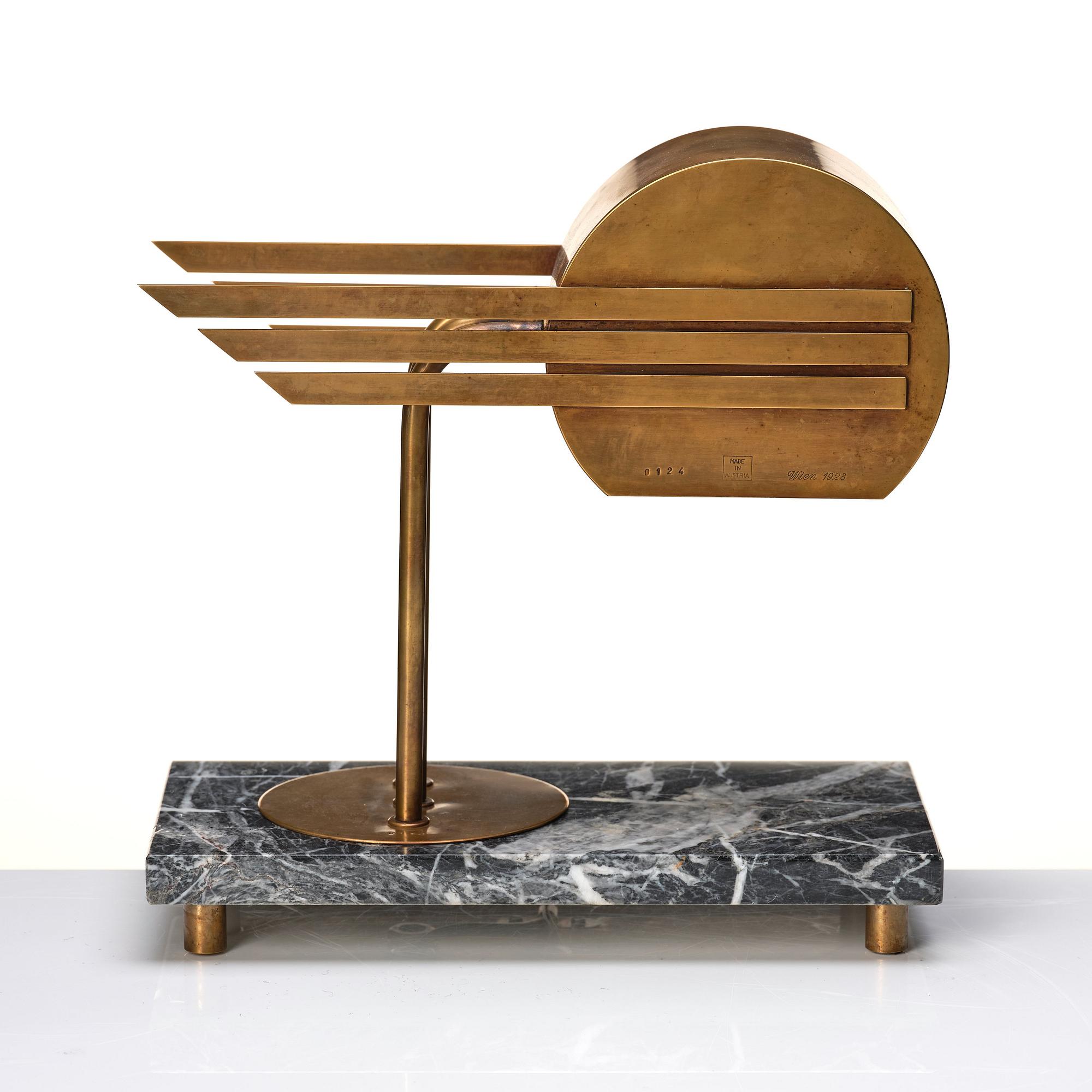 An Austrian brass and black marble table lamp, marked Vienna 1928.