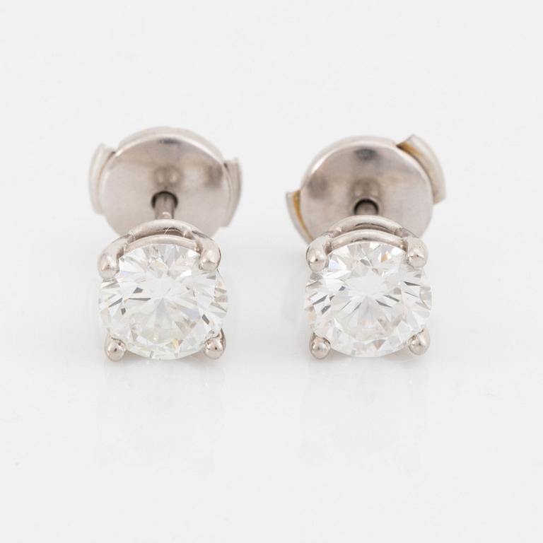 A pair of Tiffany solitaire diamond stud earrings in platinum.