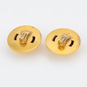 Céline, a pair of gold tone and rhinestone clip-on earrings.
