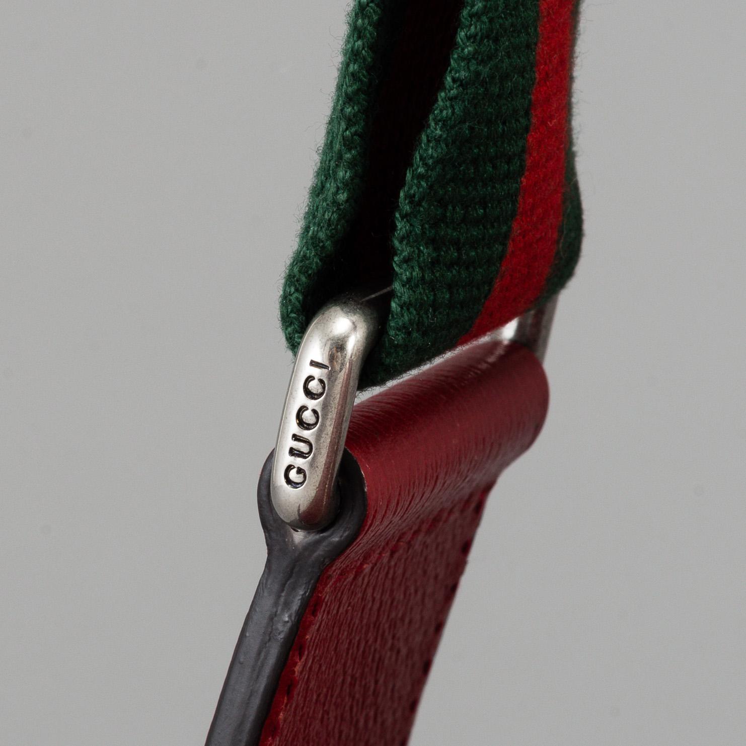 GUCCI, a patterned monogram canvas and leather bag.