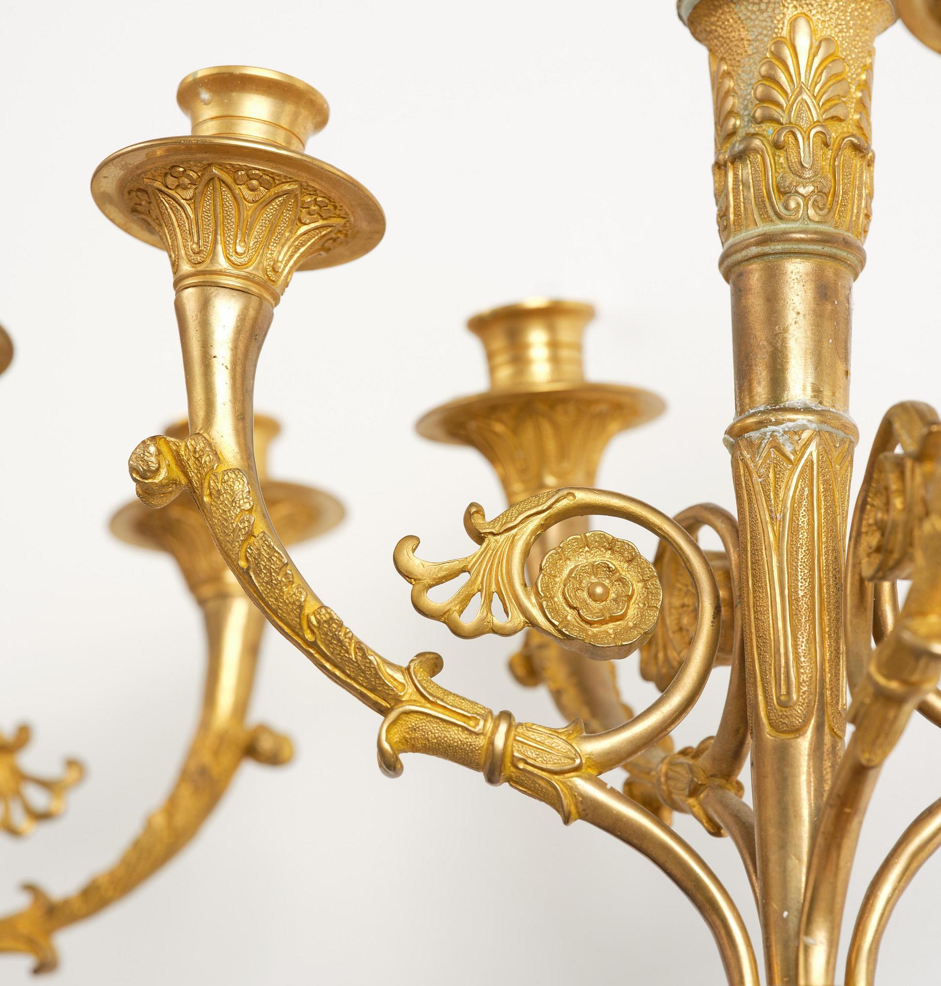 A pair of Napoleon III five-branch gilt and patinated bronze appliques.