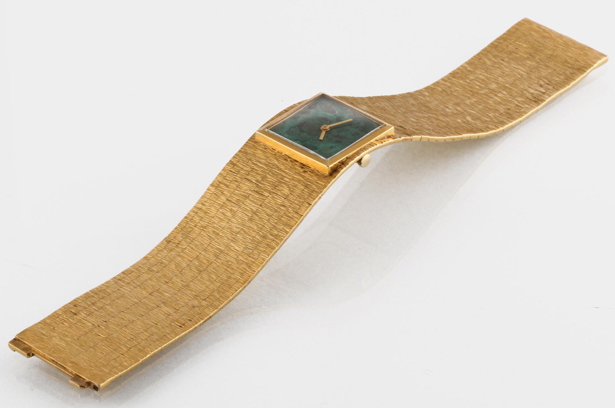 ARMBANDSUR, 14K guld samt malakit, total vikt 71g.