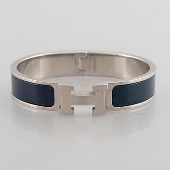 Hermès, a 'Clic H' bracelet.