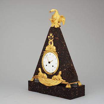 A late Gustavian early 19th Century porphyry and gilt bronze mantel clock.