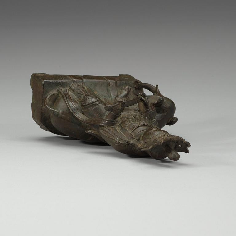 A seated bronze figure of Guanyin on an elephant, Qing dynasty, 19th Century.