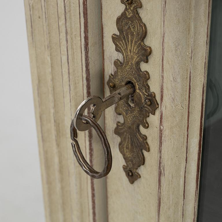 A display cabinet, late 19th Century.