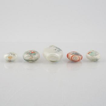 A group of nine Chinese glass and porcelain snuffbottles, 20th century.