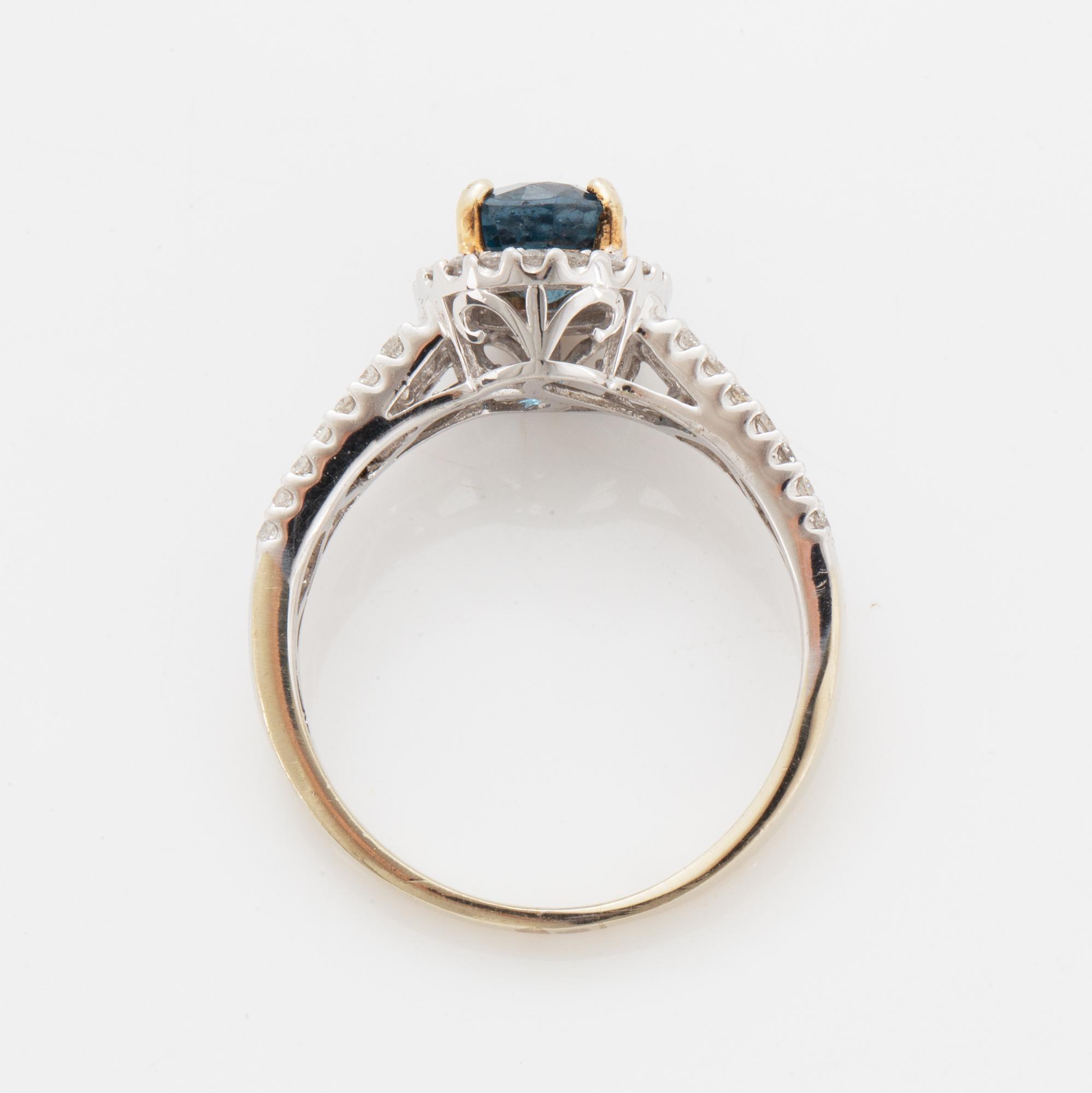 Oval faceted kyanite and diamond ring.
