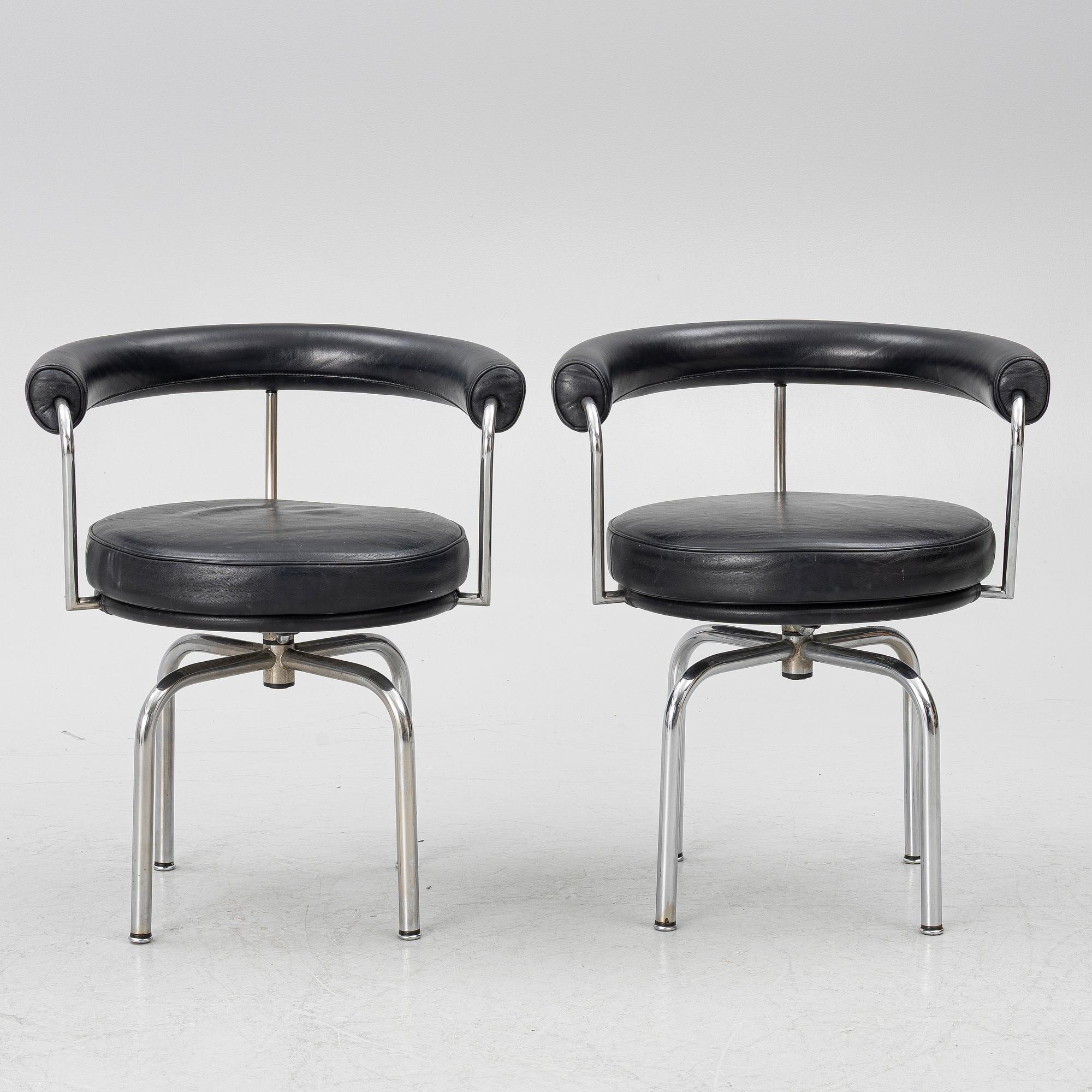Charlotte Perriand, /Le Corbusier, swivel armchairs, a pair, model LC7, Cassina, Italy, later part of the 20th century.