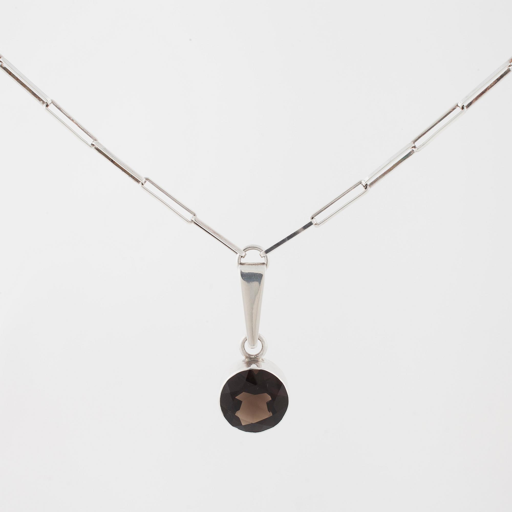 GERT THYSELL, Gussi, Malmö, 1967, a faceted smoky quartz pendant.