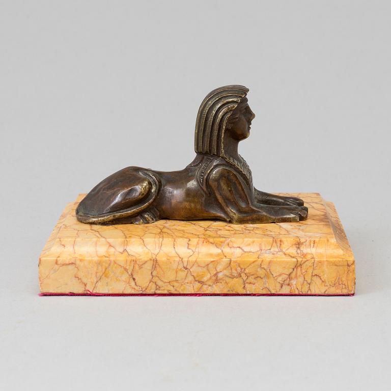 AN EMPIRE  BRONZE AND MARBLE PAPER WEIGHT, early 19th century.