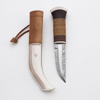 A reindeer horn and skin knife by Bertil Fällman, signed.