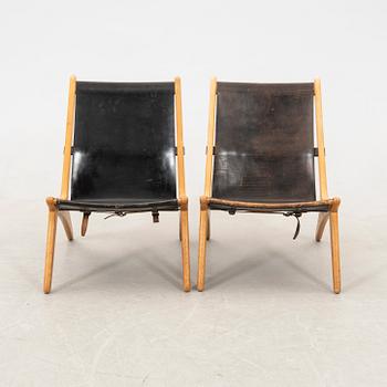 Östen Kristiansson armchairs, a pair of "Jaktstol/Vilstol 204" Luxus, Vittsjö, second half of the 20th century.