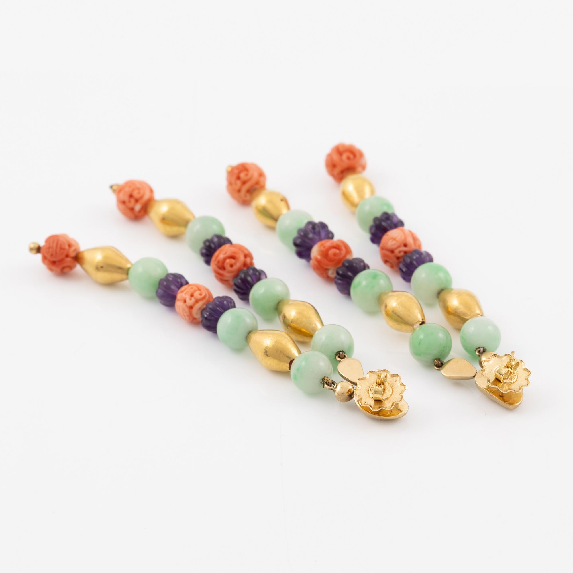 A pair of earrings in 18K gold with various coloured gemstones.
