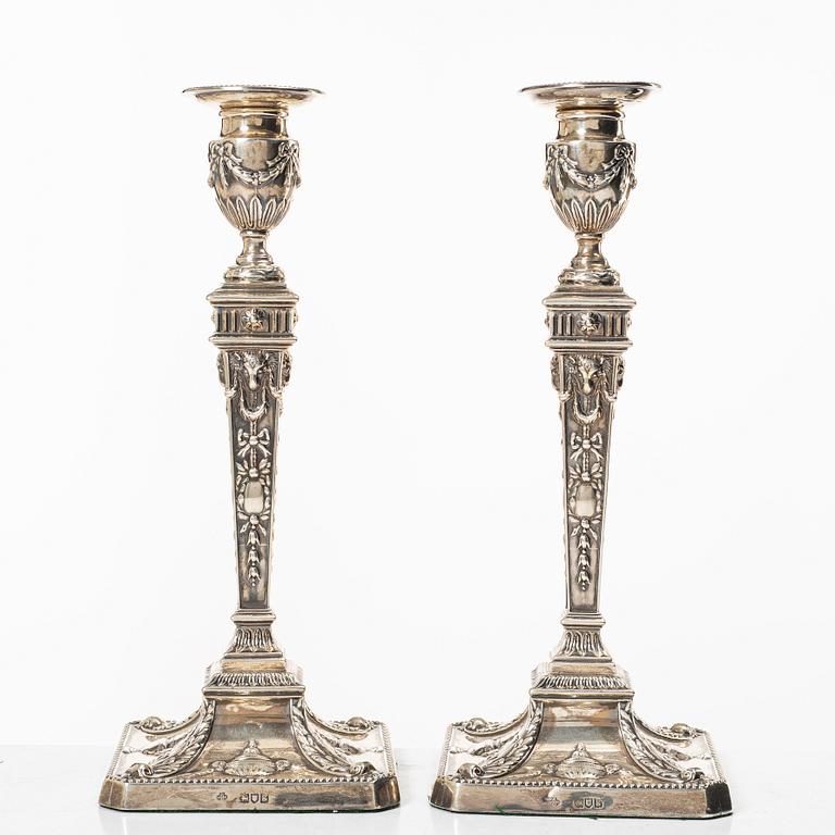 A pair of English silver candlesticks, mark of William Hutton & Sons Ltd, London 1902.