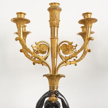 A pair of Napoleon III five-branch gilt and patinated bronze appliques.