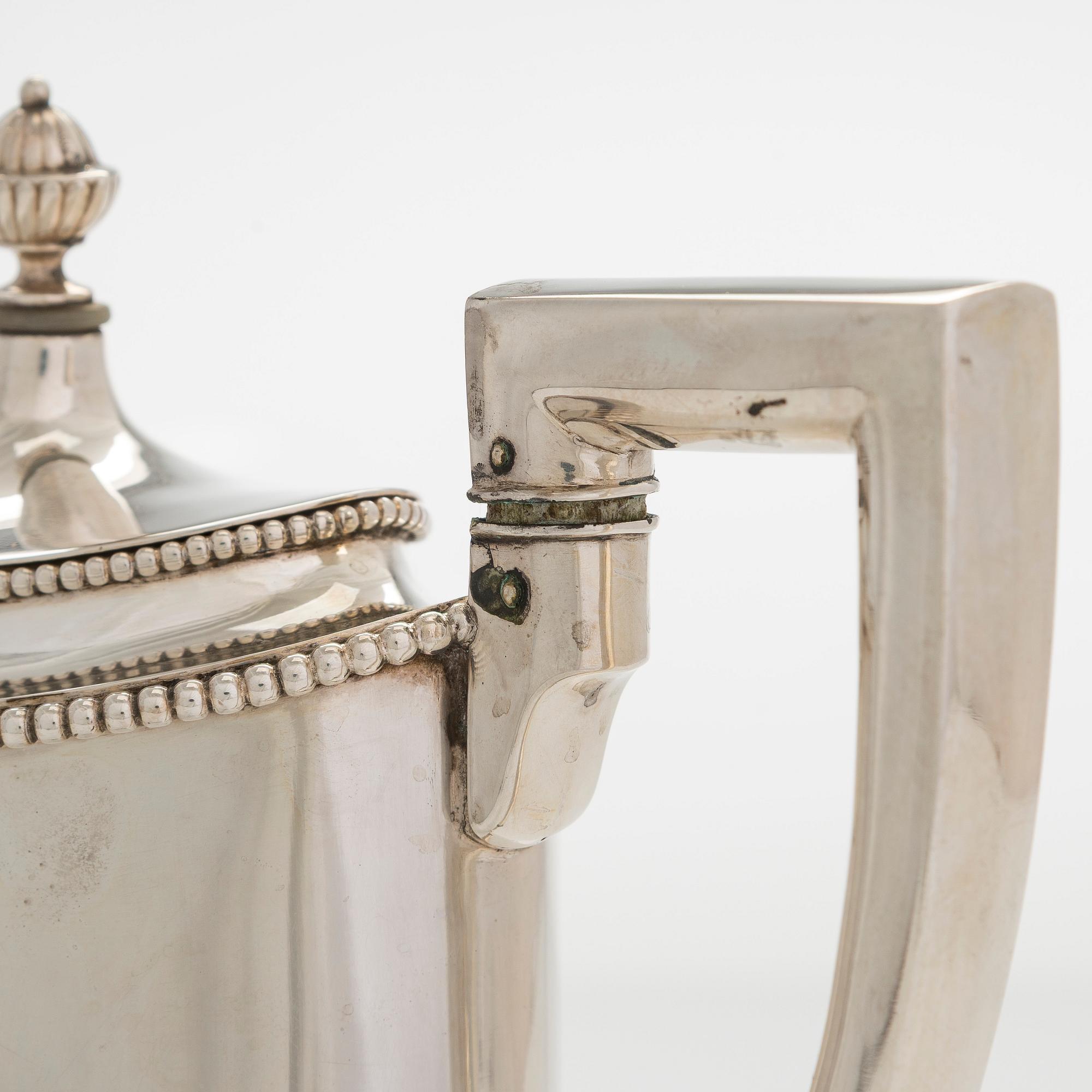 An early 20th century 4- piece sterling silver empire coffee set, C.G. Hallbergs Guldsmeds AB, Stockholm.